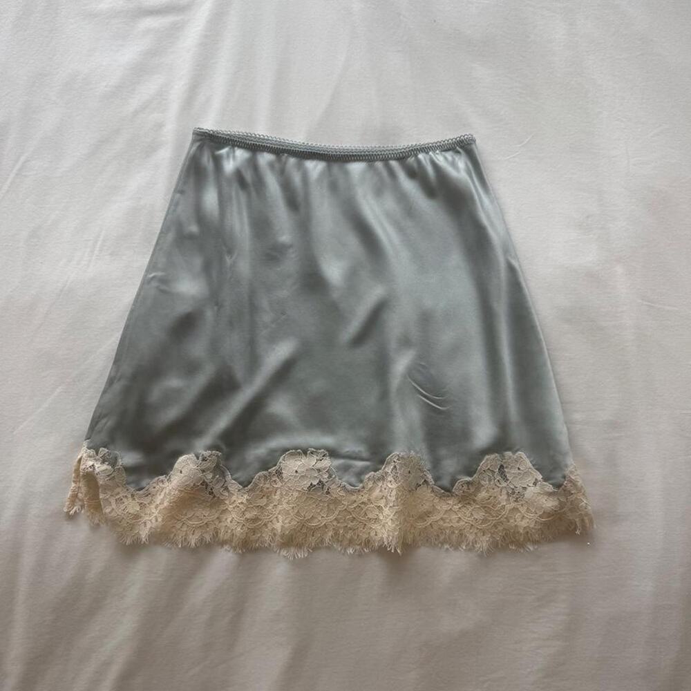 Light blue slip midi skirt with lace trim